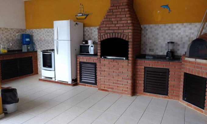 Itanhaem House | Cozy 6-Bedroom Retreat with Ocean View & BBQ Area