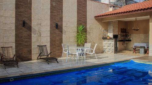 Tupy House | Relax at Our 4-Star Hotel with Heated Pool & Wi-Fi