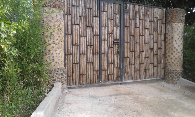 Entebbe House | Relax at the Unique Plastic Bottles House with Ocean Views