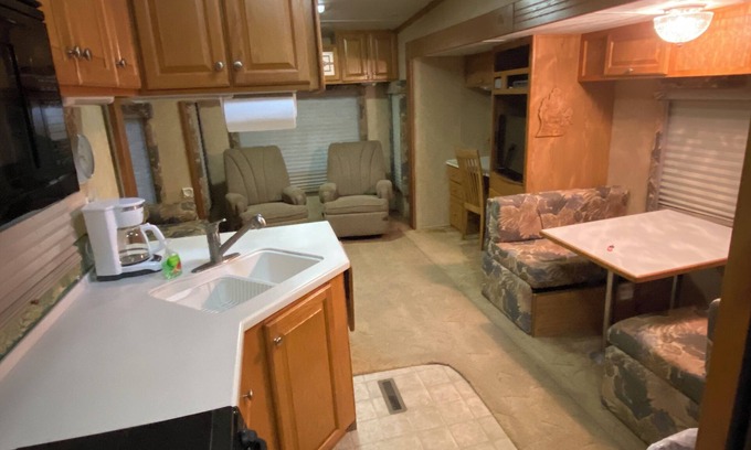 Benzonia House | Cozy RV Camper in the Woods with Hot Tub & Fire Pit Access