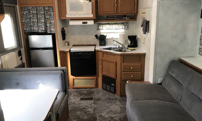 Benzonia House | Cozy RV Camper in the Woods with Hot Tub & Fire Pit Access