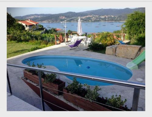 Cangas Apartment | Discover Playa de Areabrava: Family-Friendly & Pool Access