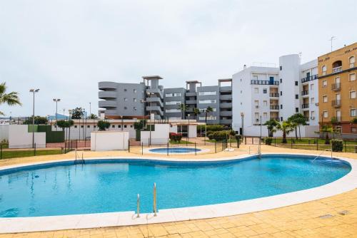Isla Cristina Apartment | Oceanfront Playa del Cantil with Pool and Family-Friendly Amenities