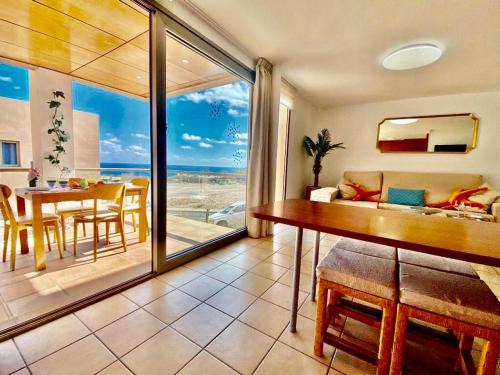 Esquinzo Apartment | Relaxing Playa Esquinzo: 4-Star Oceanfront Retreat