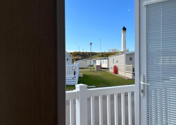 Lossiemouth Resort | Discover Playa la Casa: Oceanfront Oasis with Pool Access