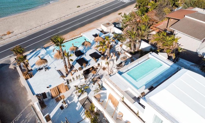 Marina di Lizzano Bed & Breakfast | Elegant Playa Paraiso: Oceanfront Retreat with Pool Access