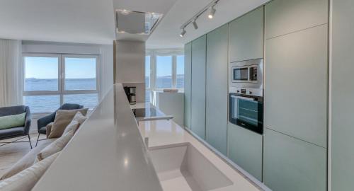 Bueu Apartment | Discover Playa Petís: Oceanfront Escape with Perfect Rating