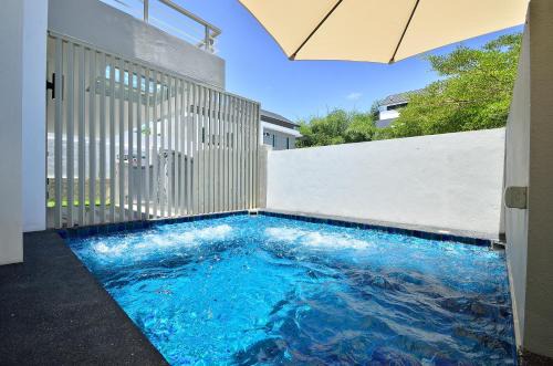 George Town Villa | Elegant Plumeria Villa with Hot Tub & Kitchen Amenities