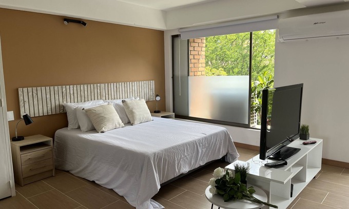 Astorga Apartment | Welcoming Poblado Park Apart Suite with Spa & Family Amenities