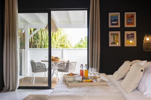 Orient Bay House | Indulge at Pomme Cannelle Suites & Spa with Oceanfront Views
