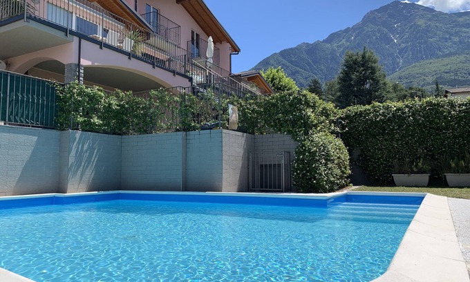 Colico Piano Apartment | Tranquil Pool Apartment with Ocean Views in Central Location