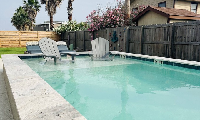 Leeward Sands House | Inviting Poolside Retreat with Ocean Views & Boat Parking