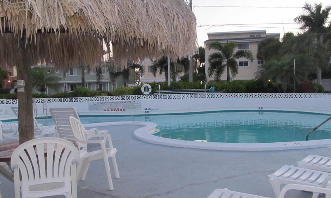 Sunset Beach Condo | Unmatched Oceanfront Escape with Pool and Fishing Dock