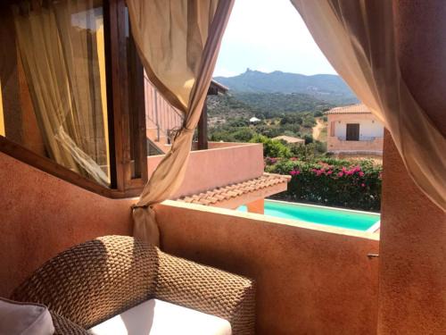 Liscia di Vacca House | Relax in a Pool Front Apartment with Ocean Views