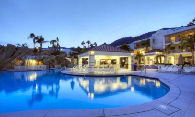 Canyon Corridor Condo | Discover Pool Paradise: Waterfalls & Poolside Bar Awaits
