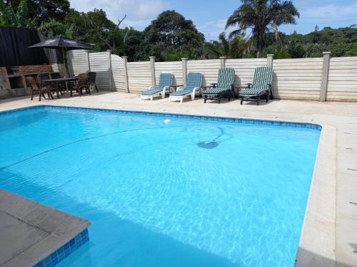 Umtentweni House | Relaxing Poolside Guest House with Ocean View Amenities