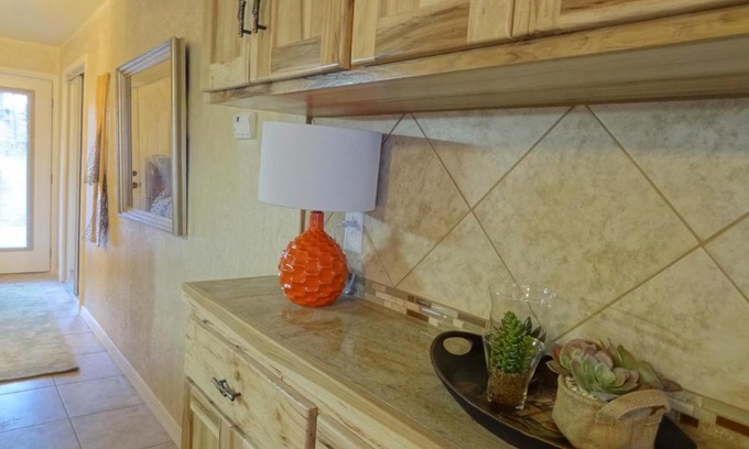 Mount Ida Hotel | Inviting Poolside Queen Cabana with Kitchen & Lake Views