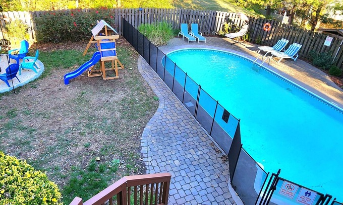 McAlpine House | Poolside Retreat - spacious 4-bedroom retreat with pool, hot tub, gym and more
