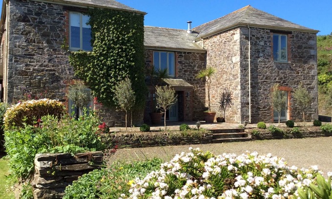 Wadebridge House | Discover Porteath Barn: Oceanfront Haven with Pool & Pets