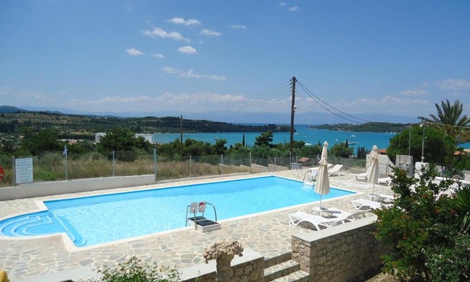 Papastavraiika Apartment | Oceanfront Porto View Suites with Pool & Family Amenities
