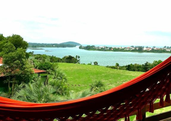 Praia do Rosa Apartment | Master Suite at Pousada Águas de Ibiraquera with Ocean View
