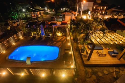 Praia do Rosa Hotel | Discover Pousada Cacau: Oceanfront Retreat with Pool