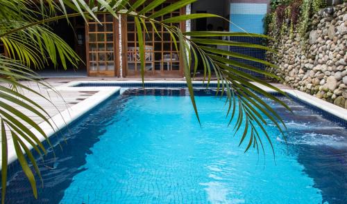 Sao Sebastiao Hotel | Discover Pousada Camburi: Family-Friendly with Pool Access