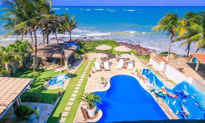 Alcacus Hotel | Discover Pousada Cocoa: Pet-Friendly Oasis with Ocean Views