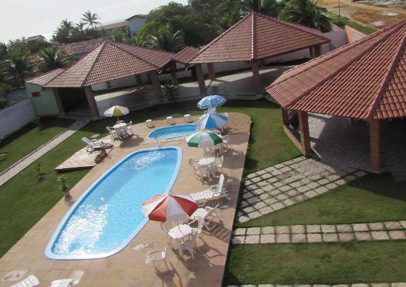 Prado Hotel | Discover Pousada Tropical: Oceanfront Retreat with Pool
