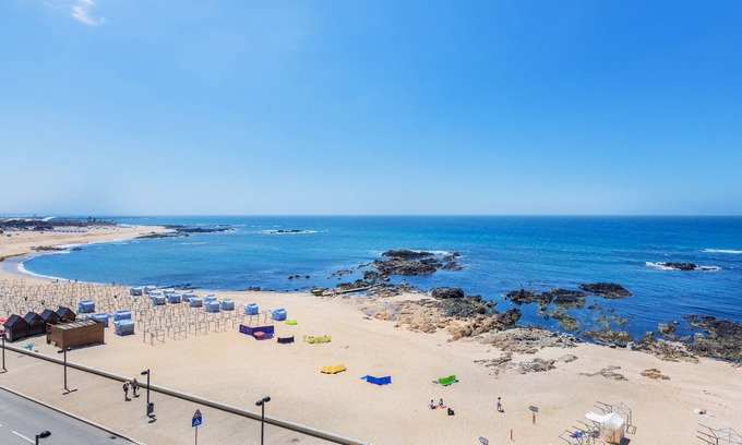 A Ver-o-Mar Apartment | Povoa Sunset Views: Oceanfront Stay with Balcony Access