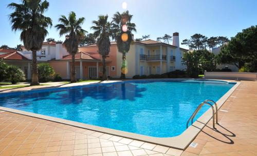 Praia del Rei Apartment | Relax at Praia Del Rey Beach with Three Inviting Pools