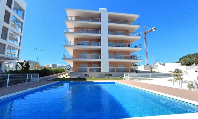 Praia da Rocha Apartment | Inviting Oceanfront Residence with Pool and Breakfast