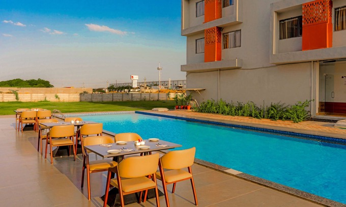 Dasada Hotel | Experience Comfort at Pride Elite Becharaji with Pool & Dining