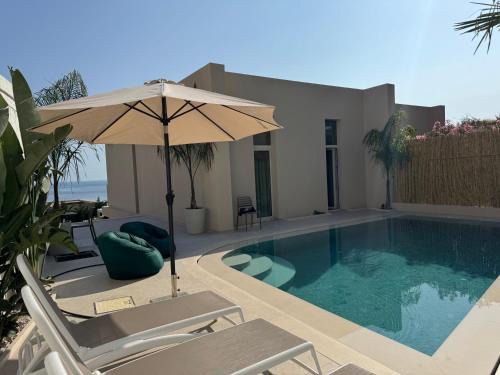 Jala Villa | Oceanfront Green Gem Villa 82A at Green Coast Palasë