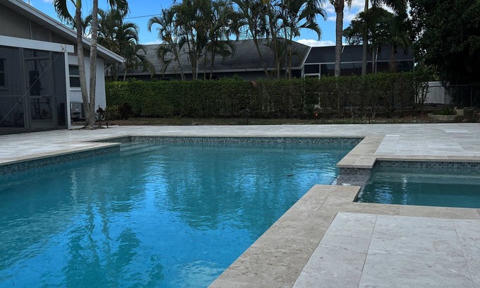Naples Park House | Exquisite Backyard Oasis with Spectacular Pool & Spa