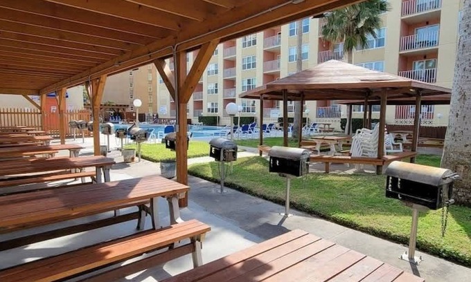 South Padre Island Condo | Beachfront 1 Bedroom with Pool, Hot Tub & BBQ Pits