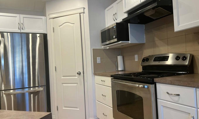 Airdrie House | Private bedroom and bathroom