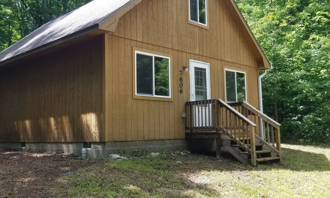 Mancelona Cabin | Cozy Cabin Retreat with Pool and Oceanfront Views