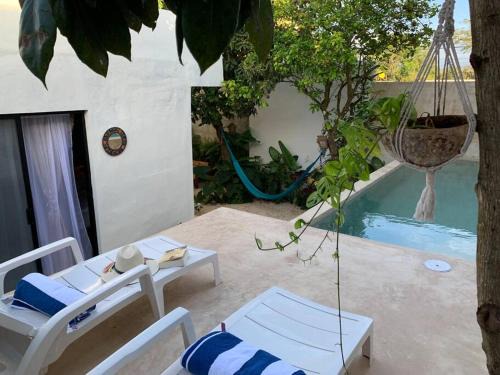 Chichen Itza - Valladolid Villa | Inviting Full House with Pool & Cozy Patio Retreat