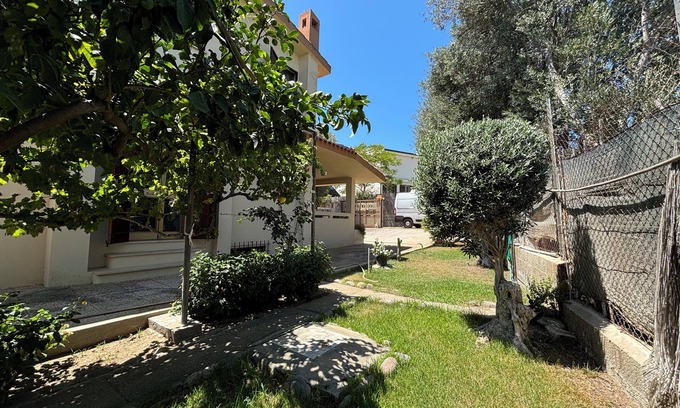 Solanas Villa | Inviting Villa with Garden, Steps from Solanas Beach