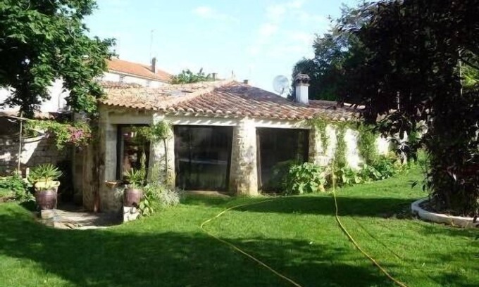 Fontenay-le-Comte Cottage | Unique Stone Cottage with Pool and Expansive Garden