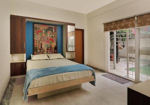 Bengaluru Other | Prutha's Nest Room 1 - opening to vibrant garden