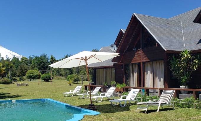 Molco Ski Chalet | Experience Los Arrayanes Chalet: Poolside Retreat in Pucon