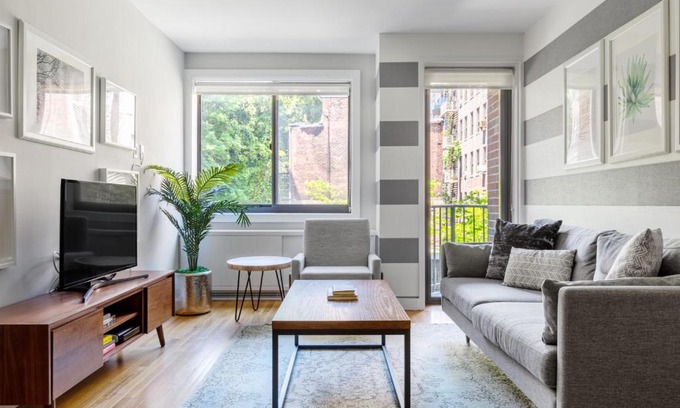 Midtown South Apartment | Charming Chelsea 1BR with Doorman, Gym & Balcony in NYC
