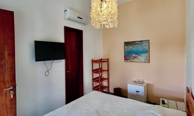 Ponta do Anel RV Rental | Elegant Oceanfront Room with Pool & Pet-Friendly Perks
