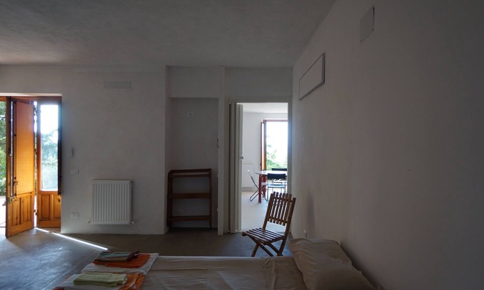 Torre Colonna-sperone Villa | Tranquil Oceanfront Apartment with Garden Near the Sea
