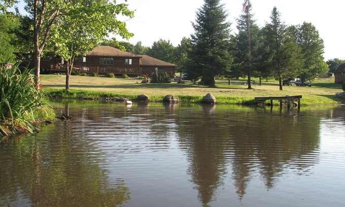 Parish House | Tranquil Log Home with Scenic Ponds and Spa Amenities