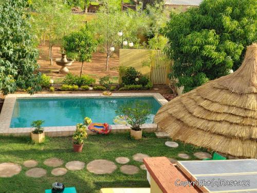 Ouagadougou Villa | Relax at Résidence des Hibiscus-Roses: Pool & Ocean Views