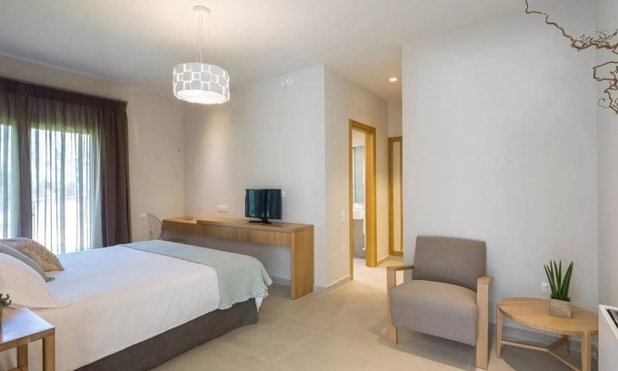 Agios Matthaios Villa | R 3250 Villa Hampton With Bath Amenities ,Coffee Facilities & Garden View.