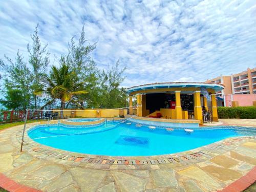Shanzu Apartment | Inviting Rocky Sands Beachfront Apartments with Pool & Ocean View